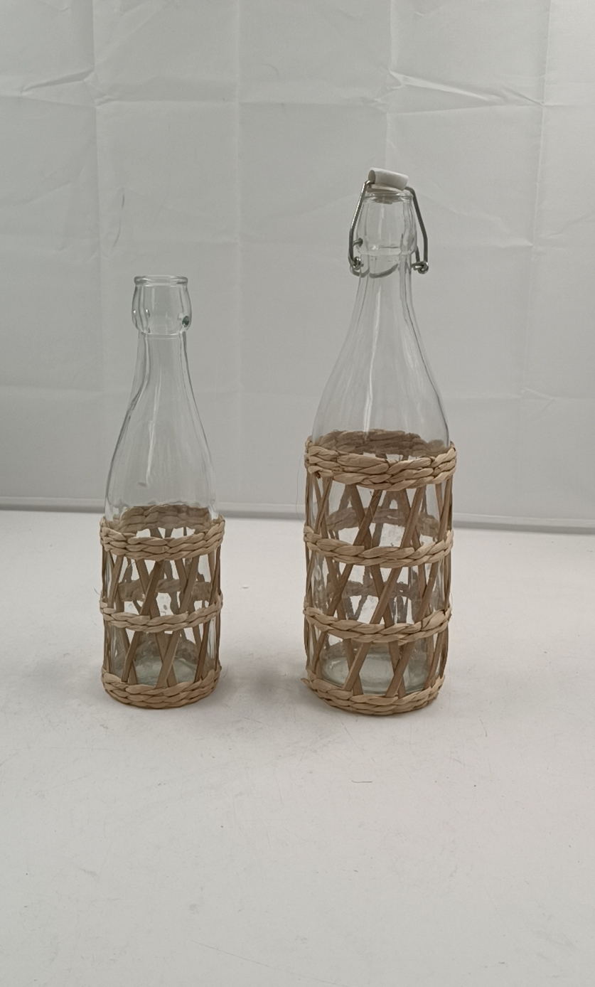 Glass bottle with grass ratten sleeve