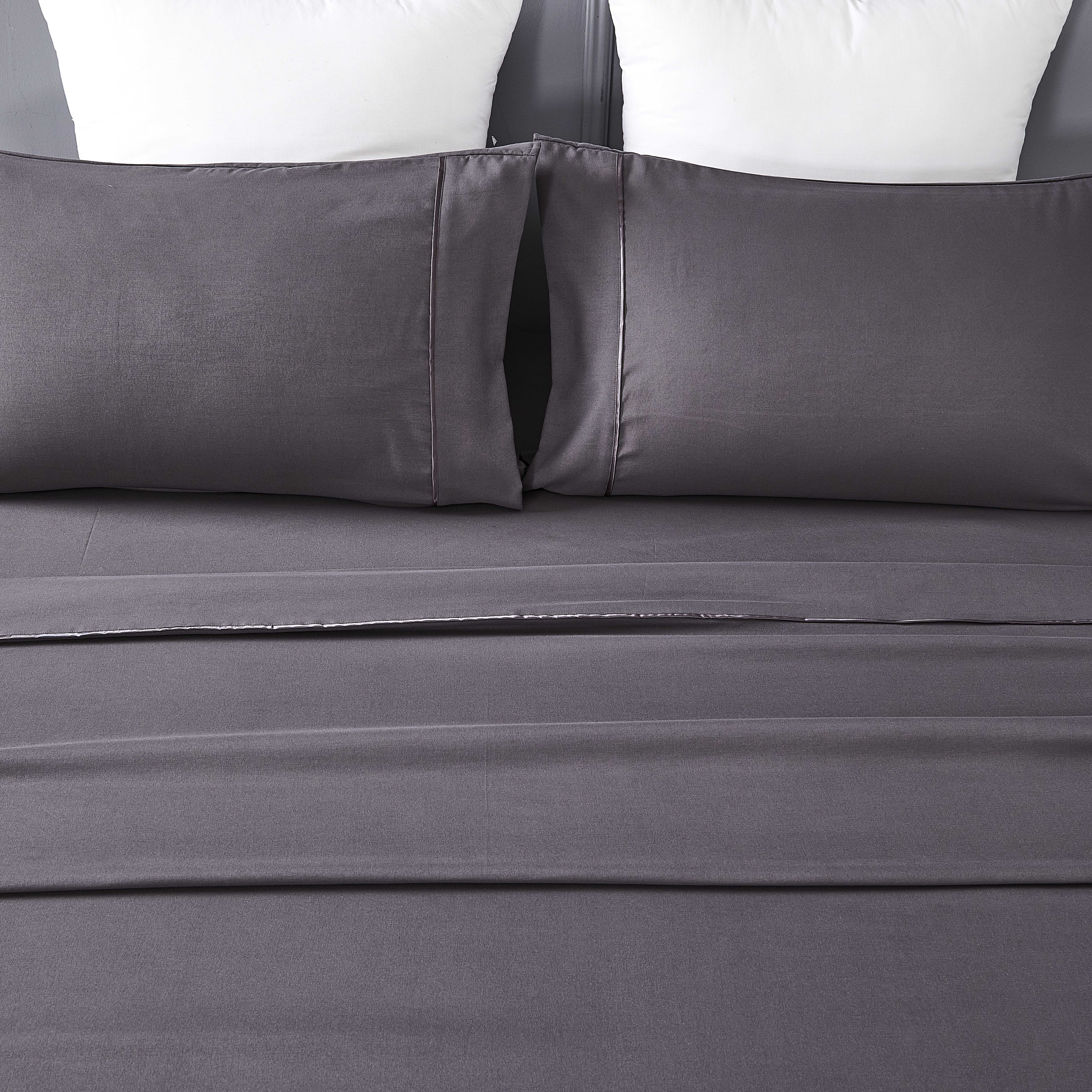 Microfiber sheet sets with satin piping