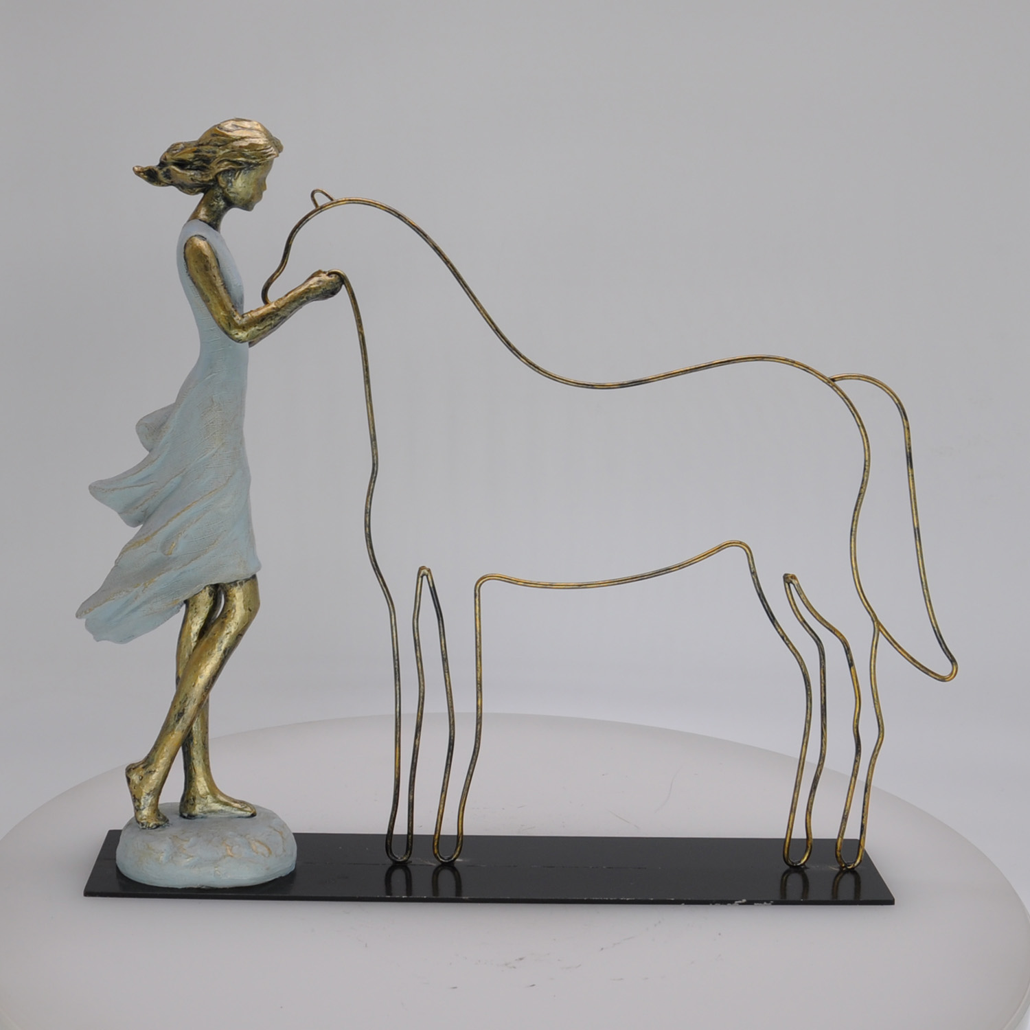 Polyresin figurine with metal home decoration