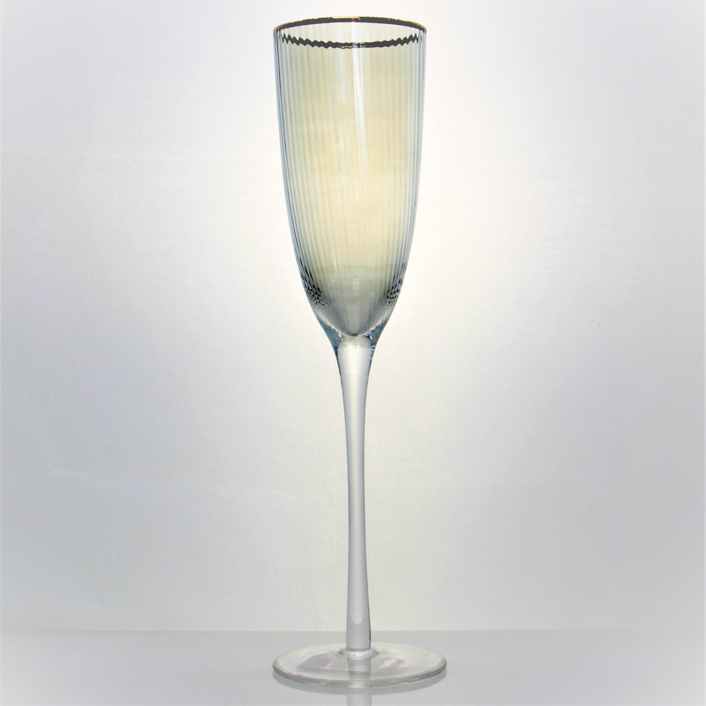 Ribbed clear champagne glass with gold rim
