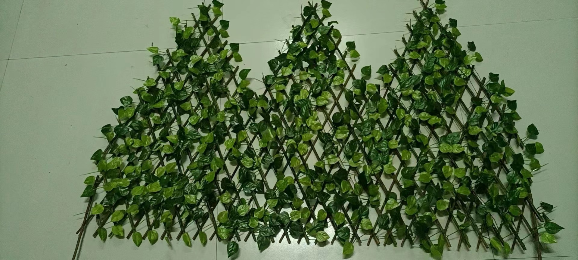 willow trellis with artificial leaves and artificial flowers