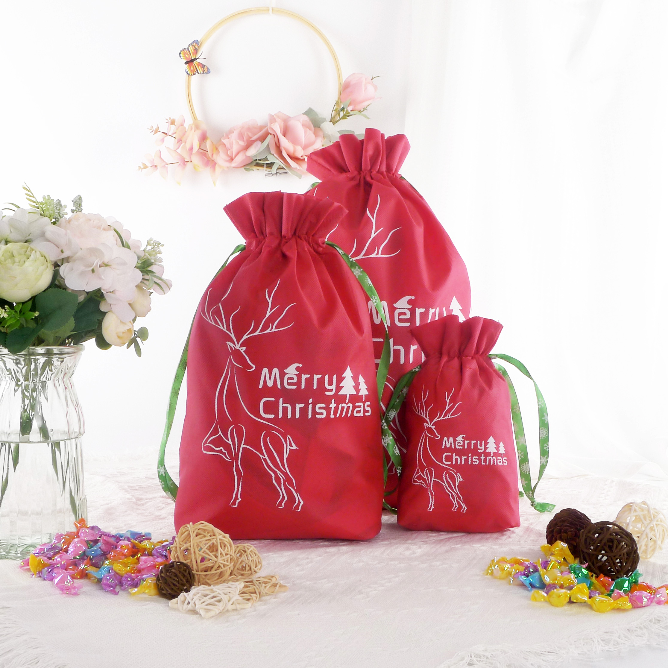 2022 New Design Customized Logo Christmas Candy Pattern Non woven Drawstring Bags For Gift