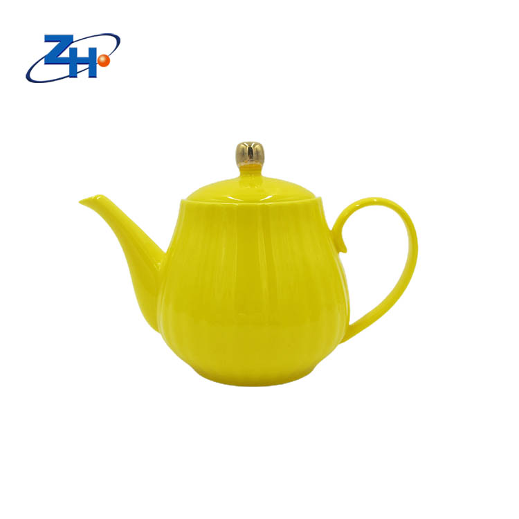 Yellow color glazed bone china teapot in pumpkin shape