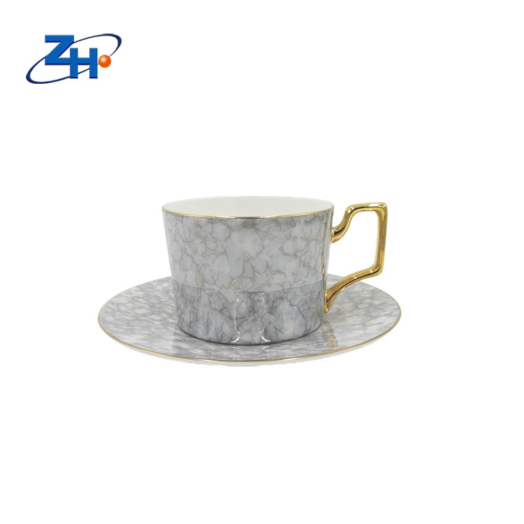 Bone china coffee cup and plate with electroplated gold handle