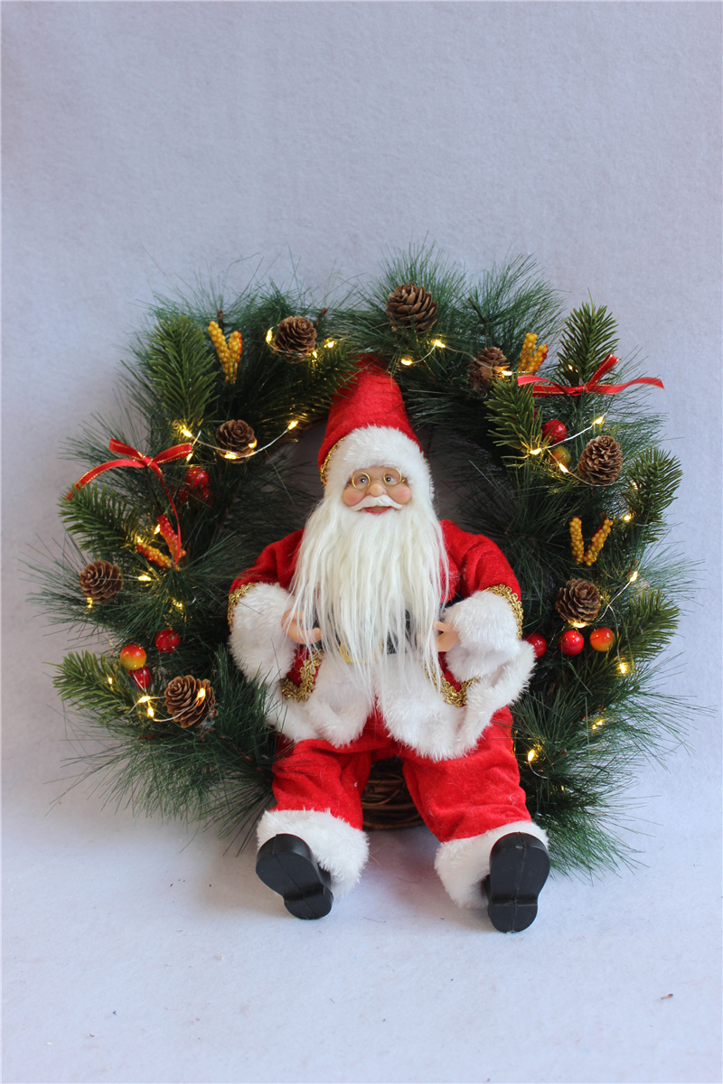 LED wreath with sitting Santa