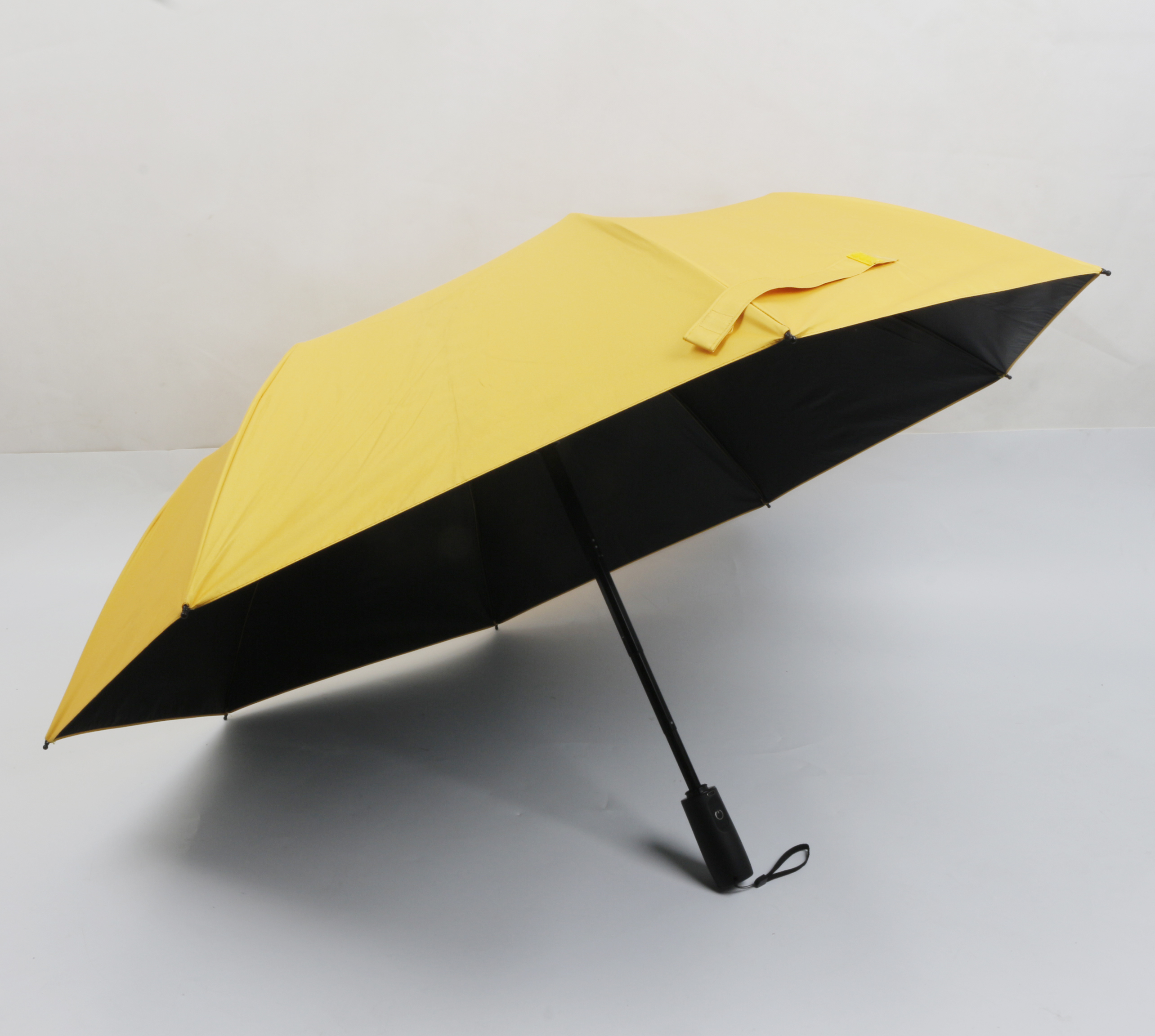 Three folding umbrella with fan