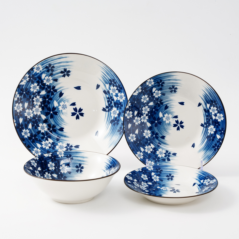 Blue ceramic tableware reflected by flowers in water