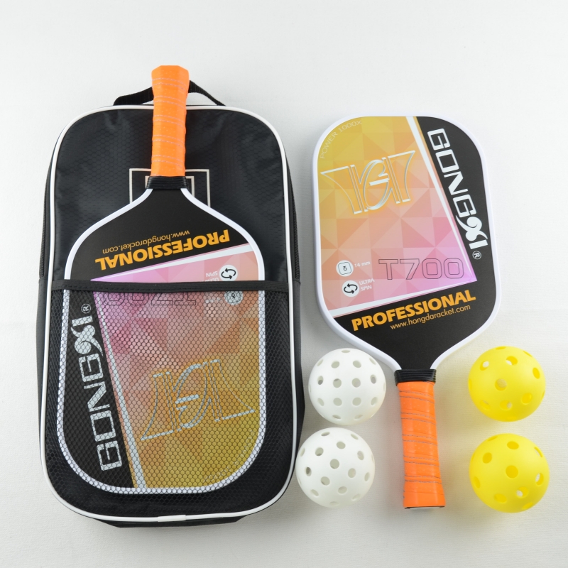 Elongated carbon pickleball paddle