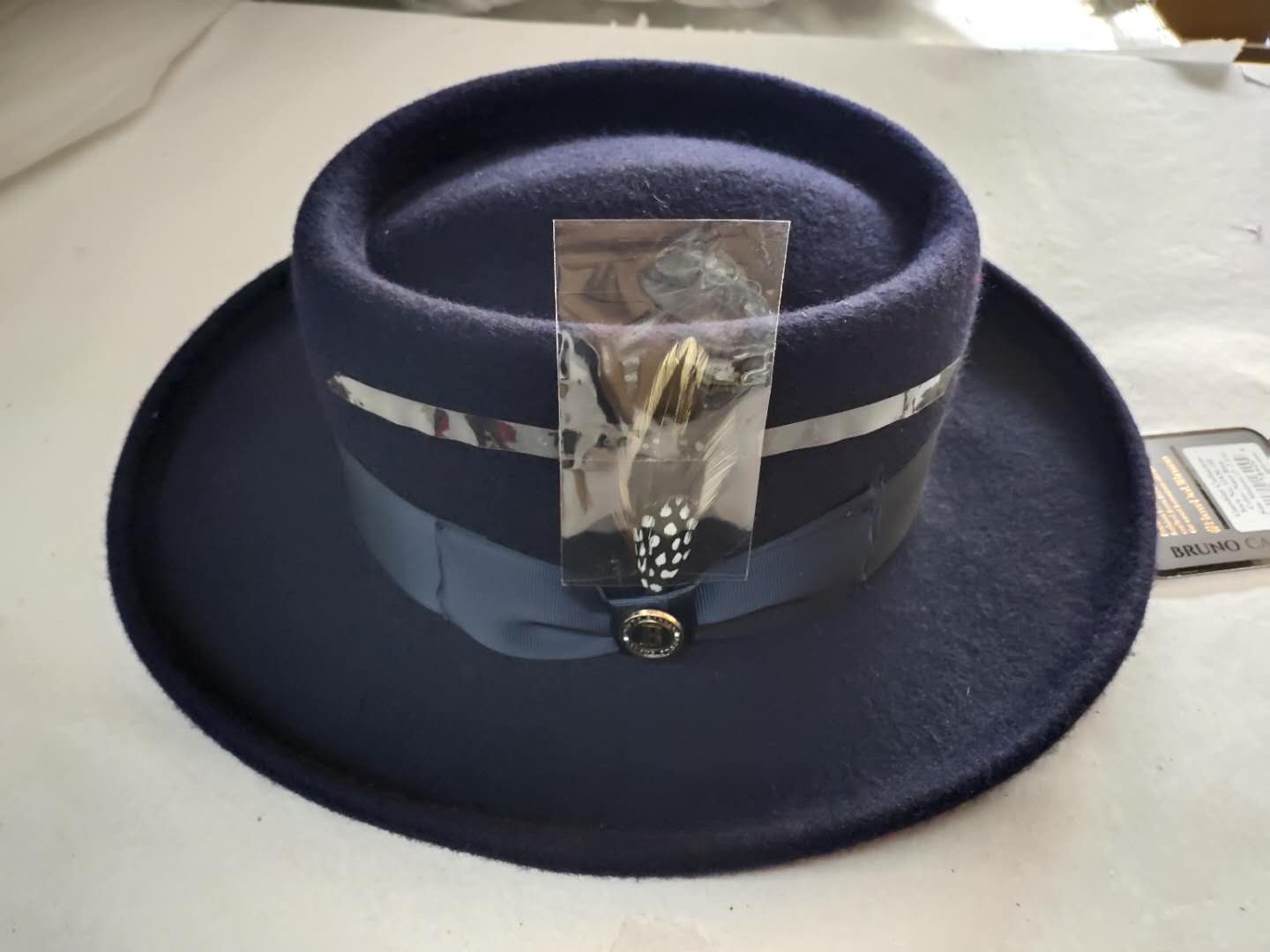 Large brim wool felt hat with feather