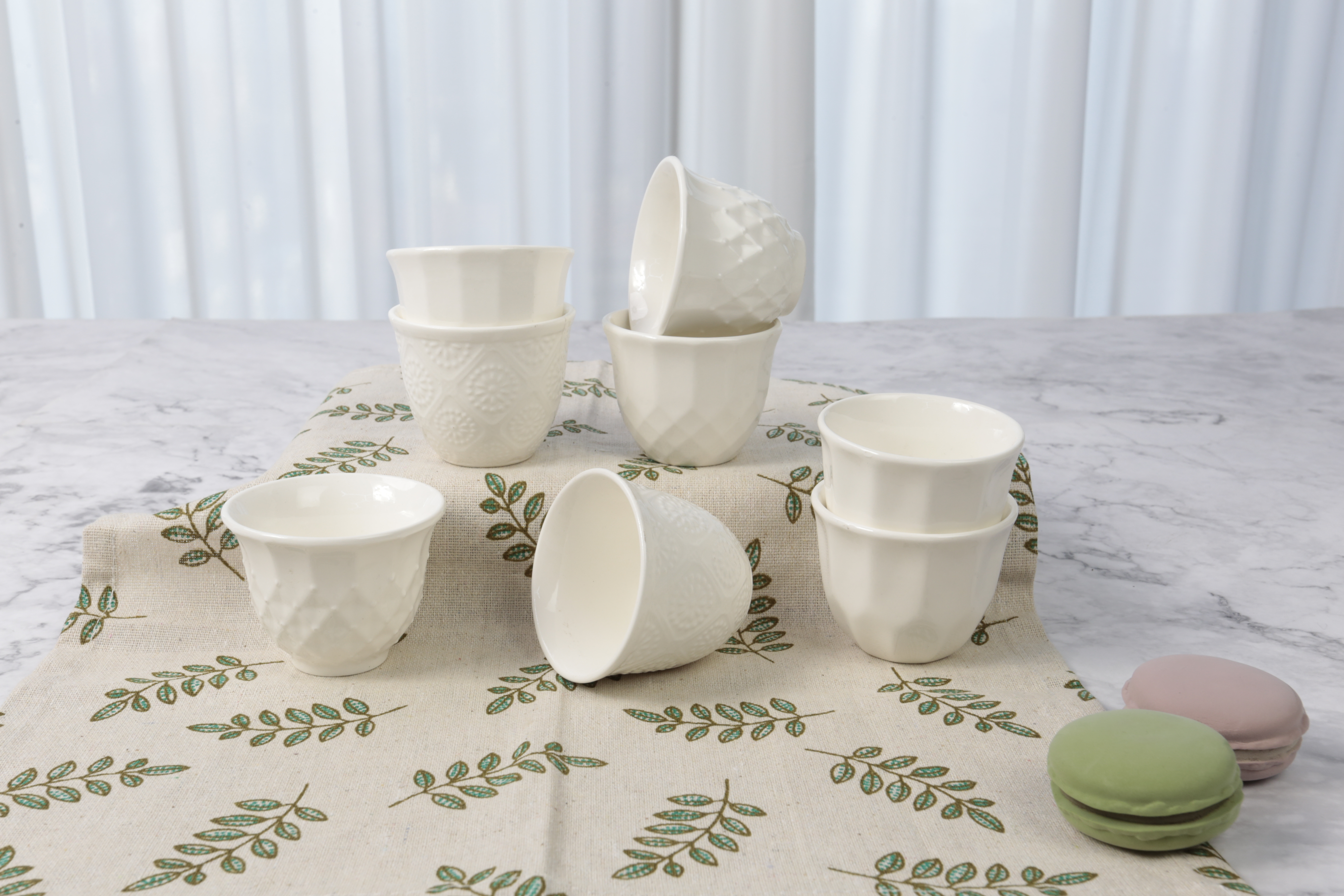 porcelainware embosseb mugs