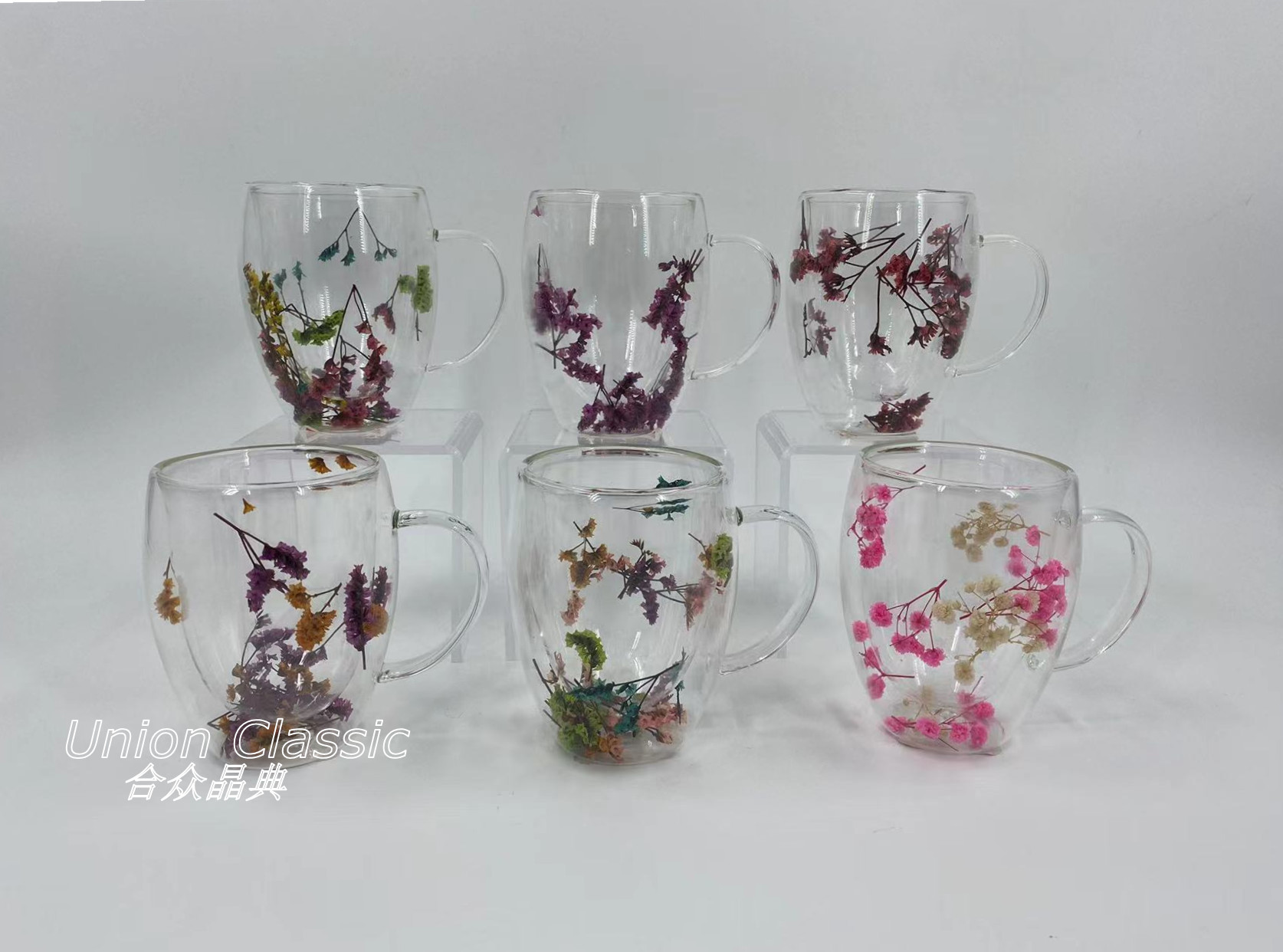 All clear double wall borosilicate glass mug inside with dry flower.