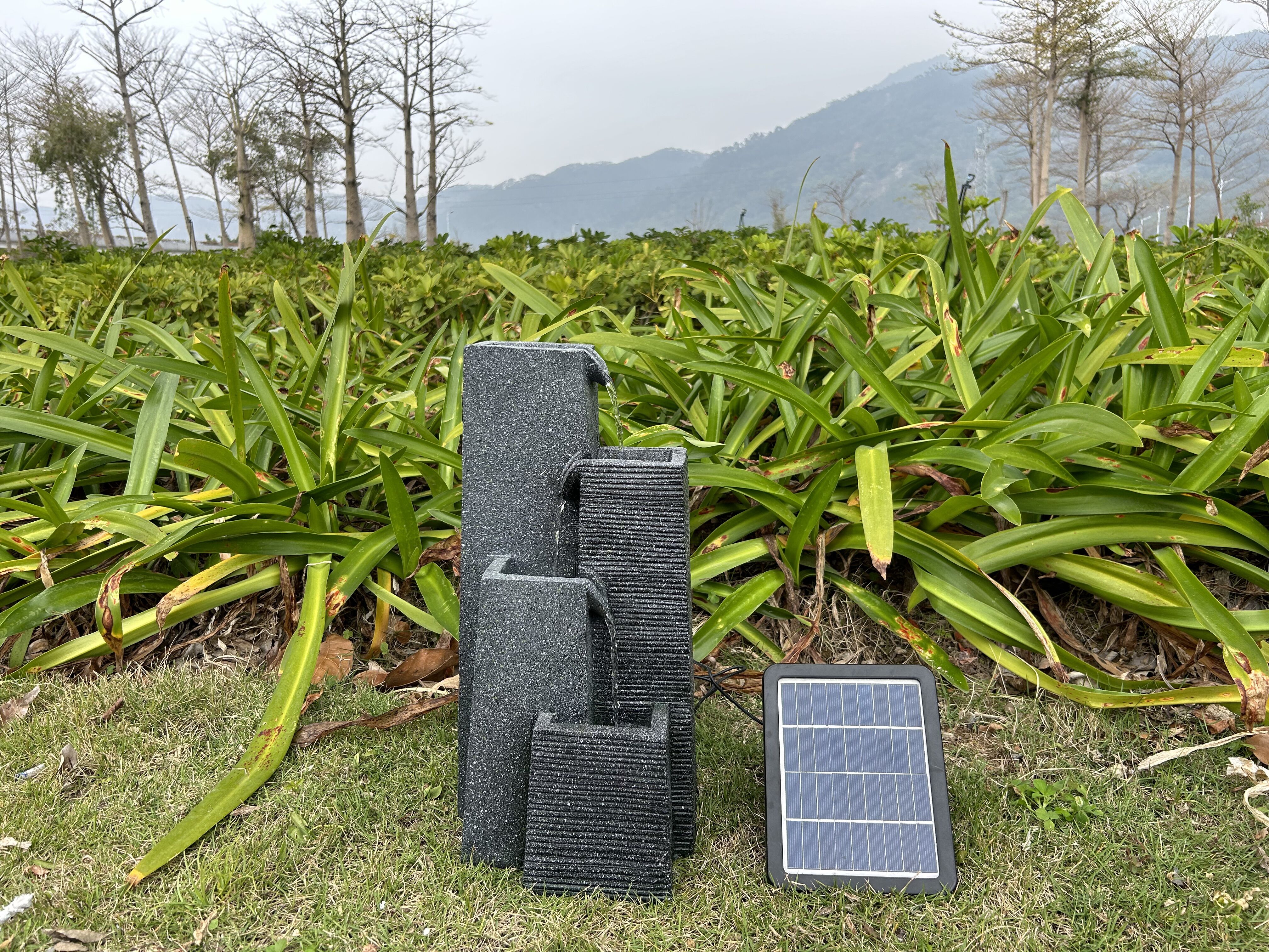 Green energy solar fountain with four layer