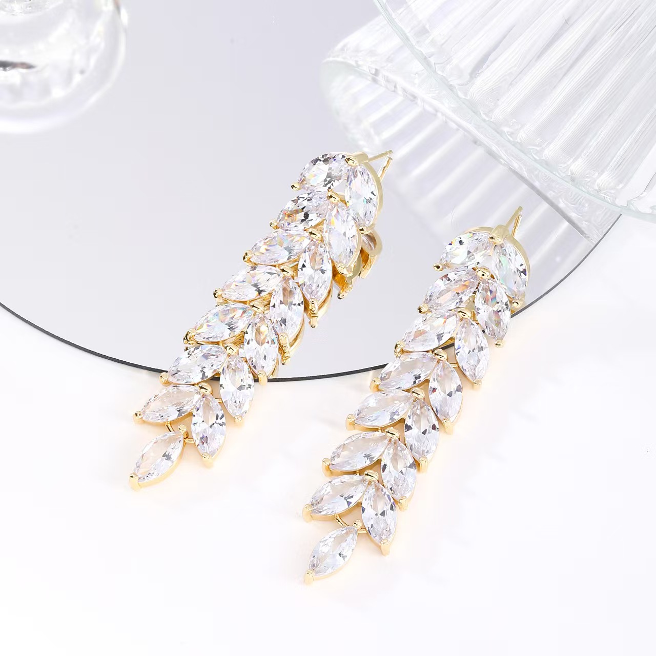 Popular wax inlaid zircon white gold rice tassel earrings in Europe and America
