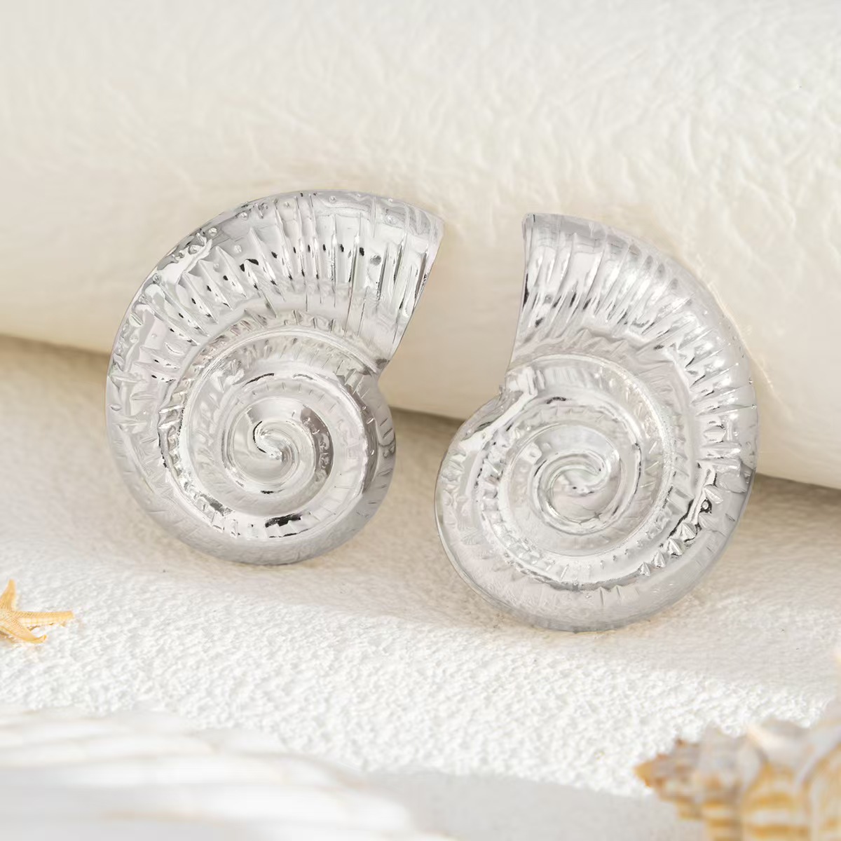 New cross-border spiral conch stainless steel beach high-end earrings from Europe and America