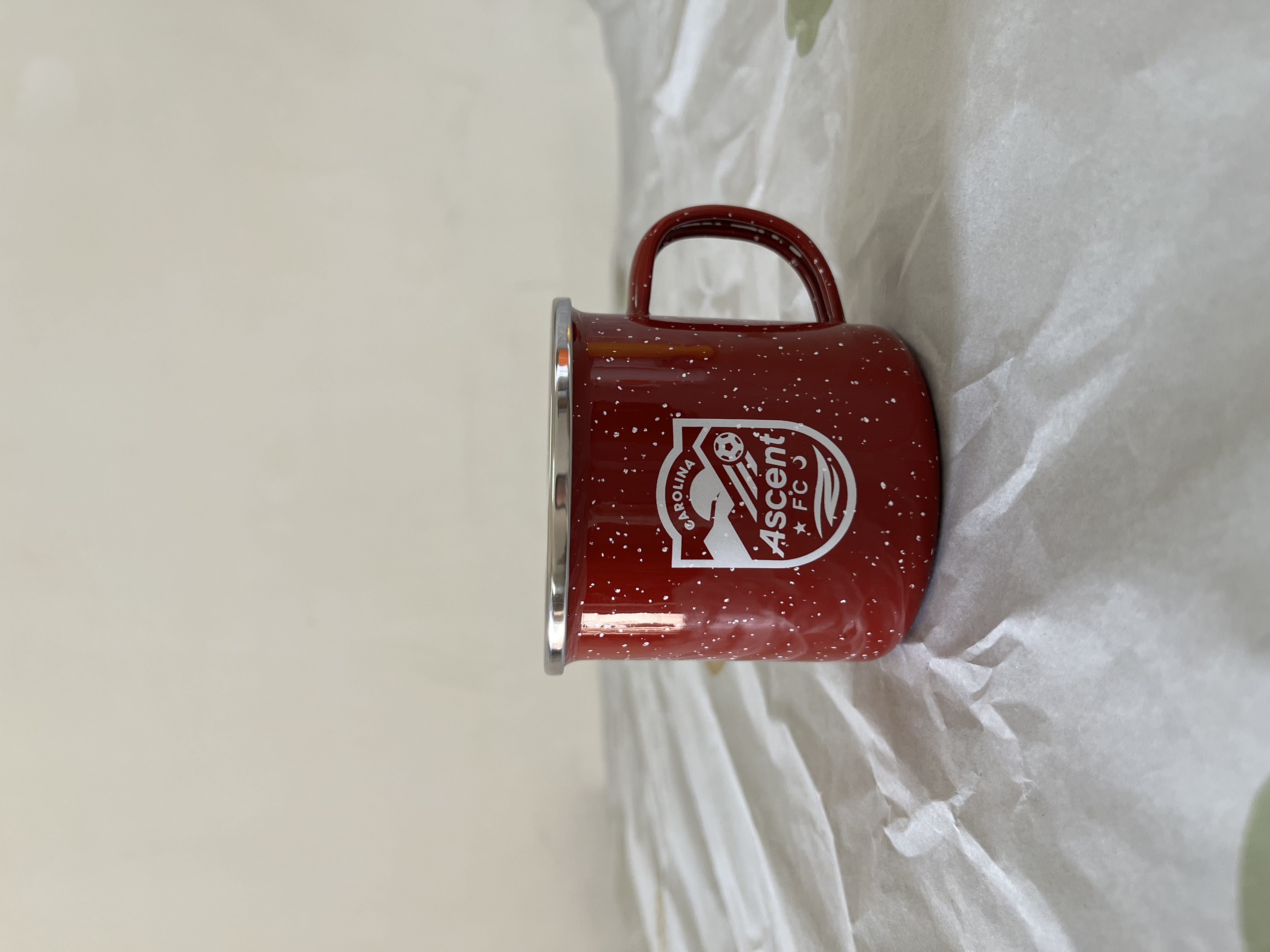Enamel mug with white inside and red outside with white spots