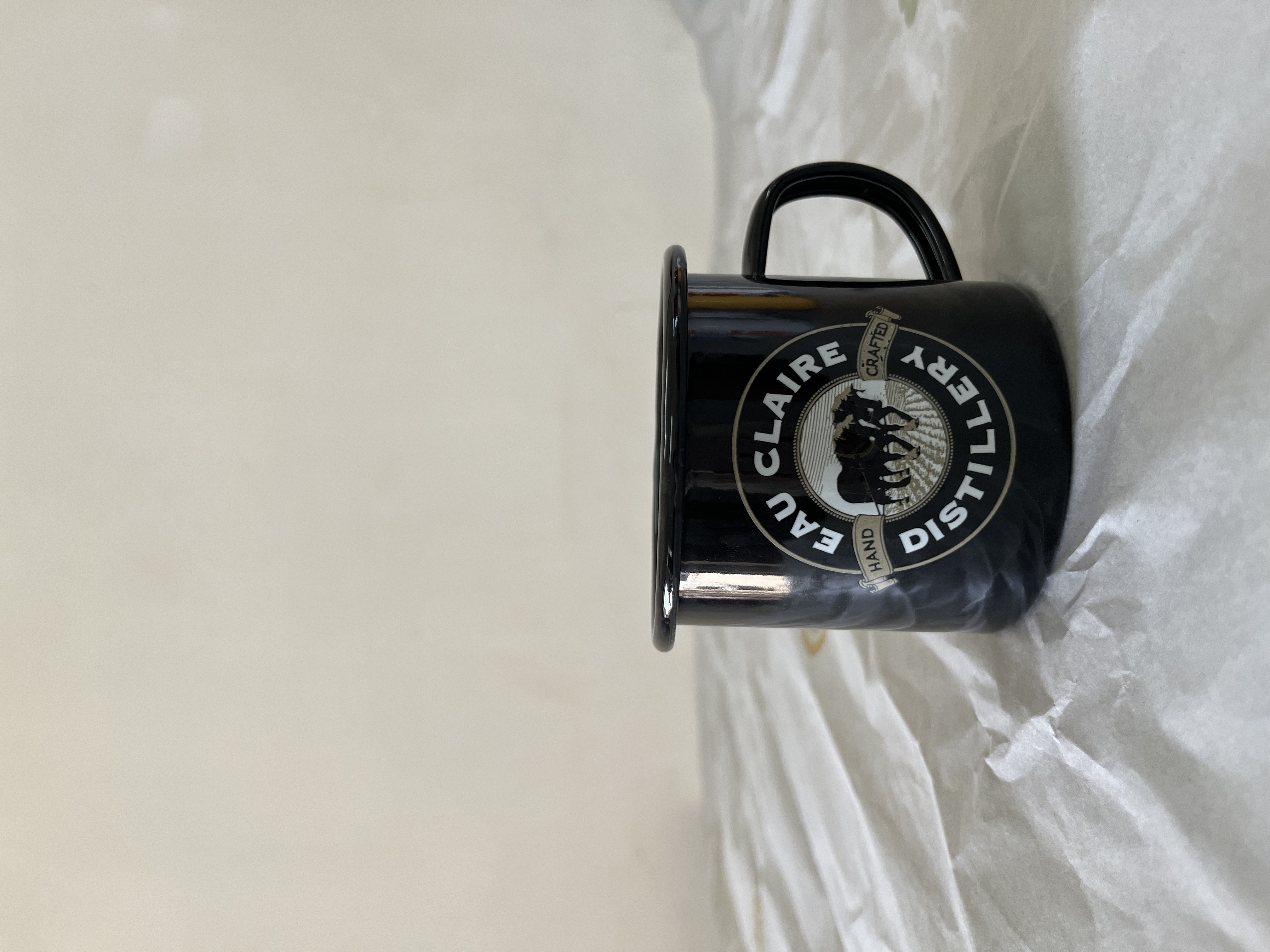 Printed enamel mug with white inside and black outside