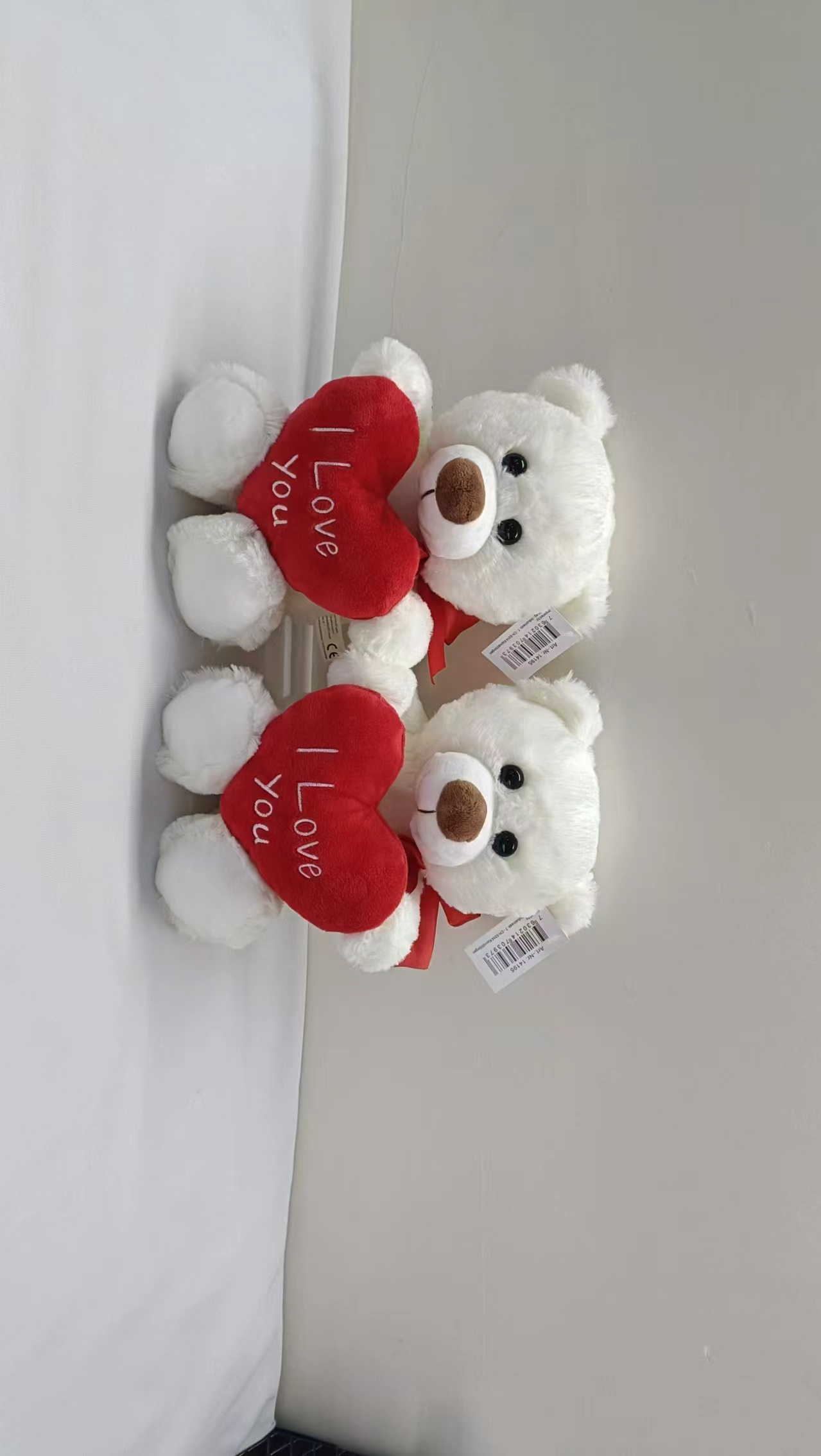 plush bear holding heart