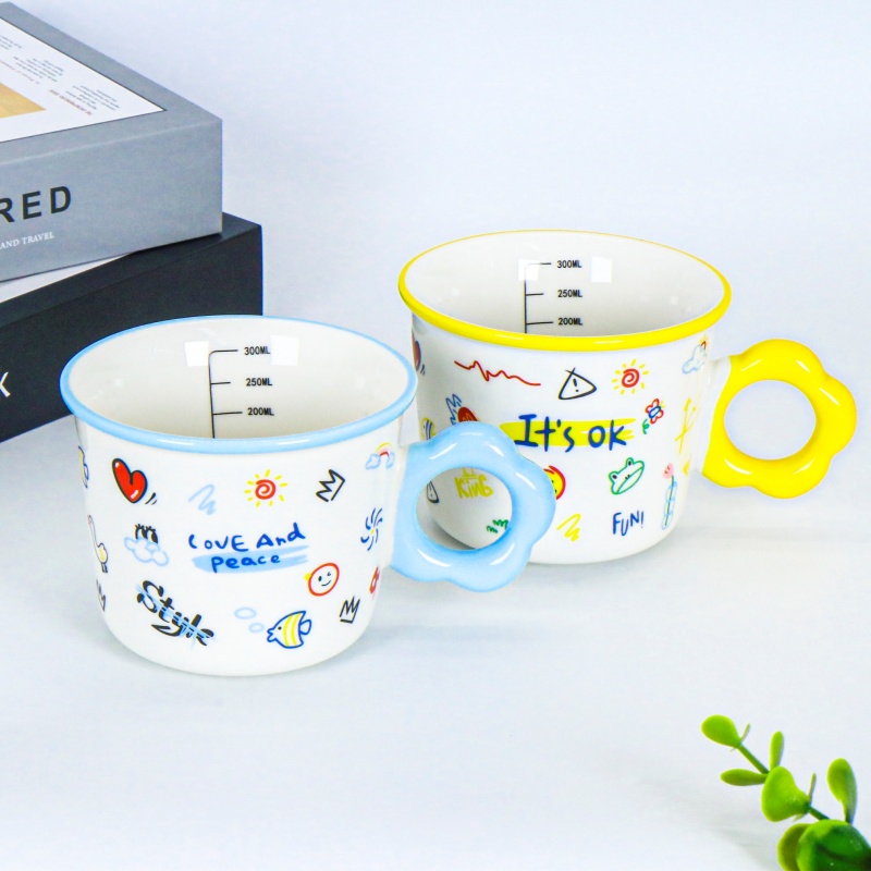 Hand-painted ceramic mug with floral handle