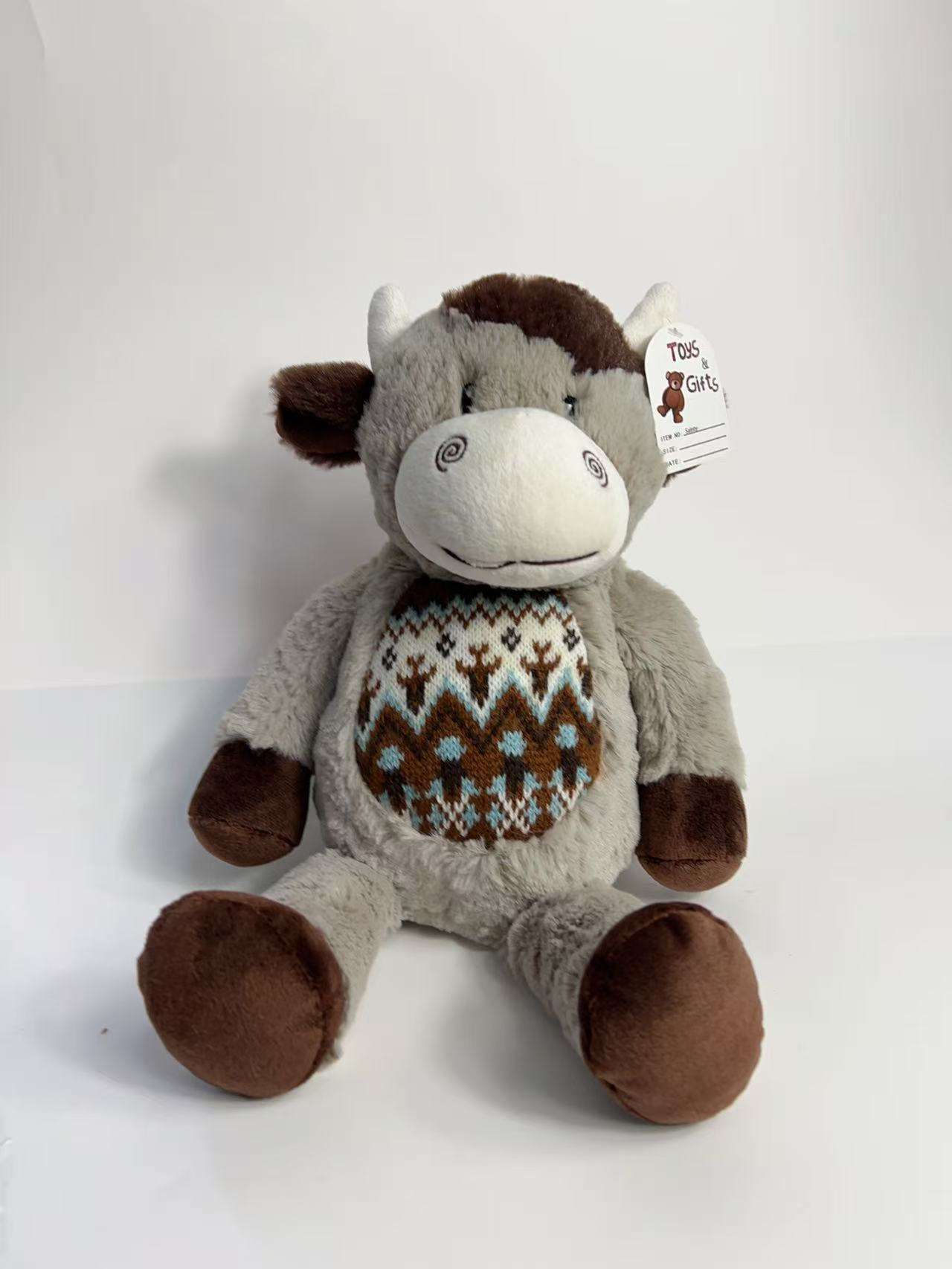 Knitted plush cow