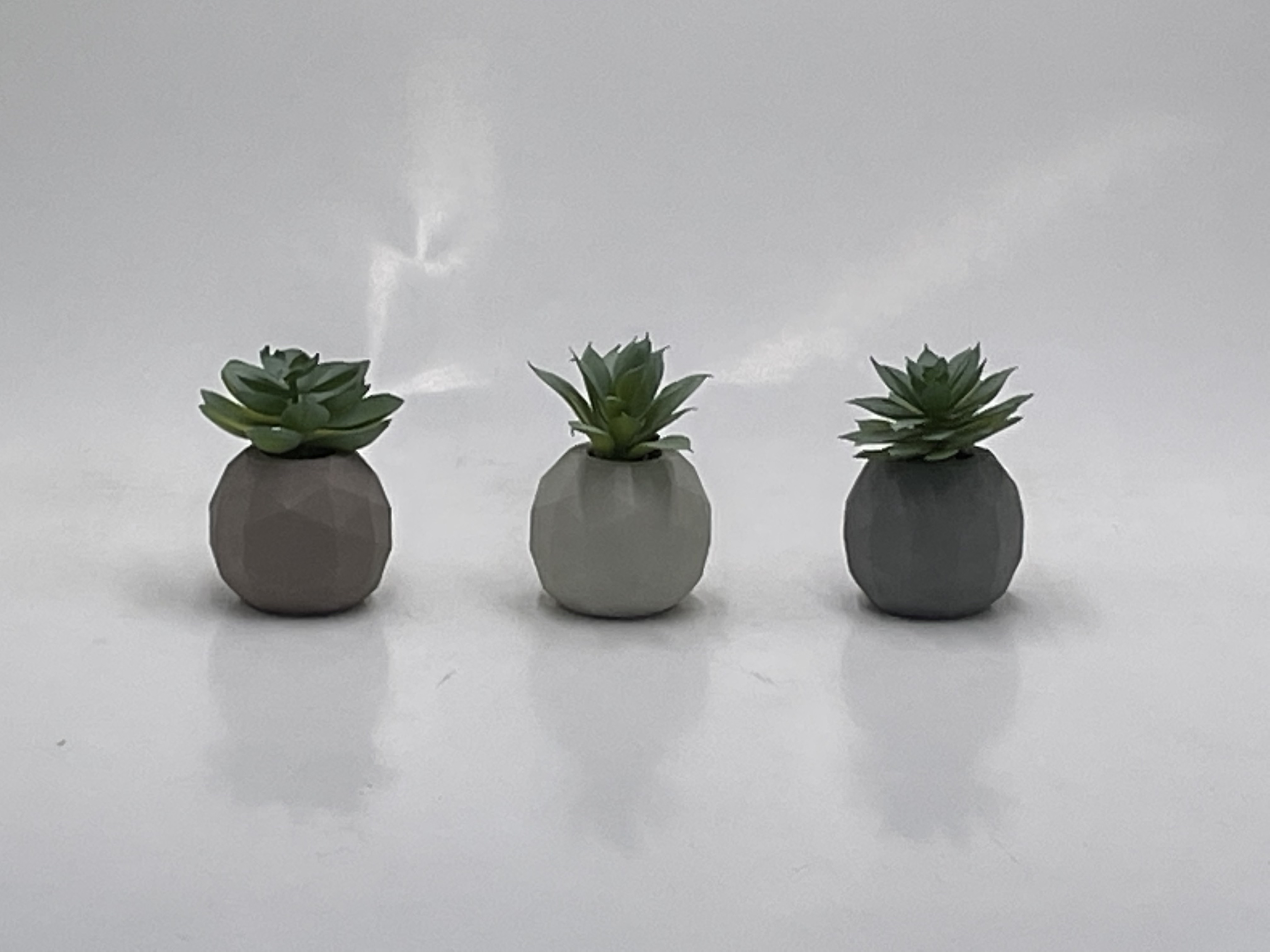 Cement pot with artificial succulent