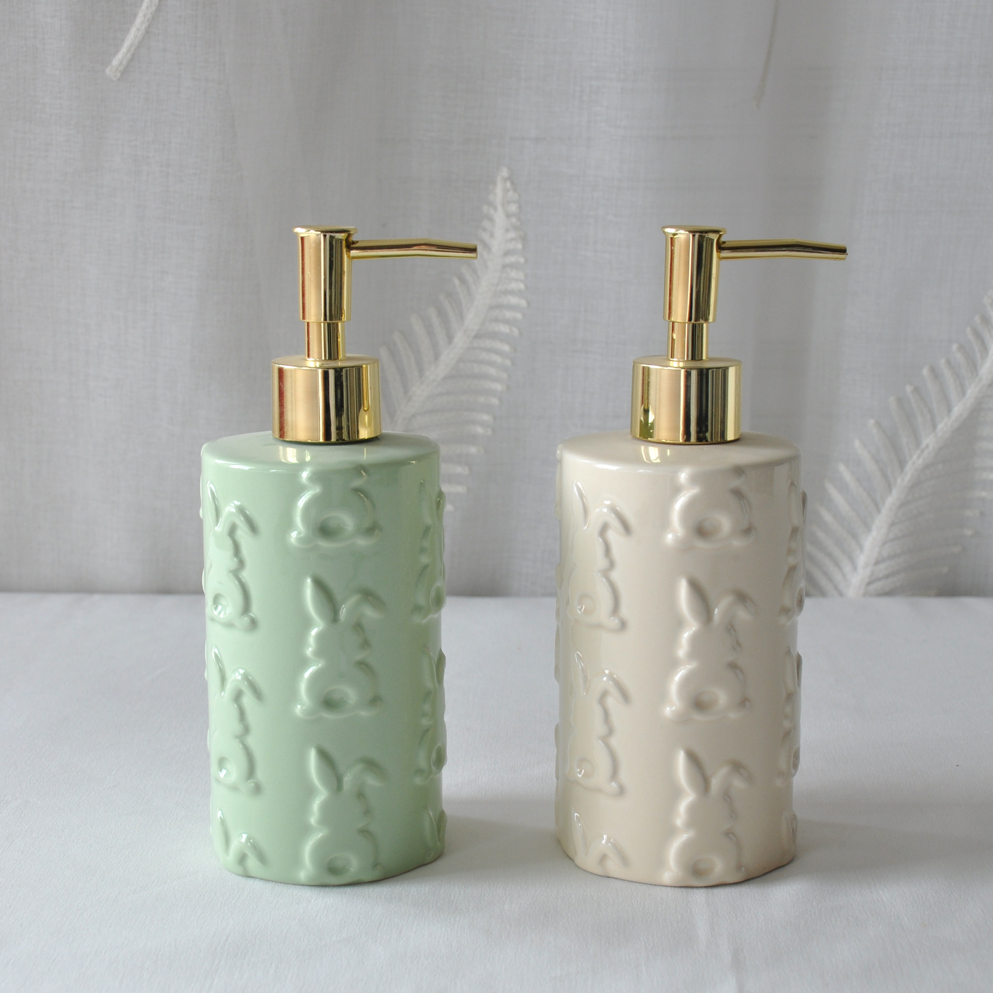 Embossed pigmented ceramic lotion dispenser