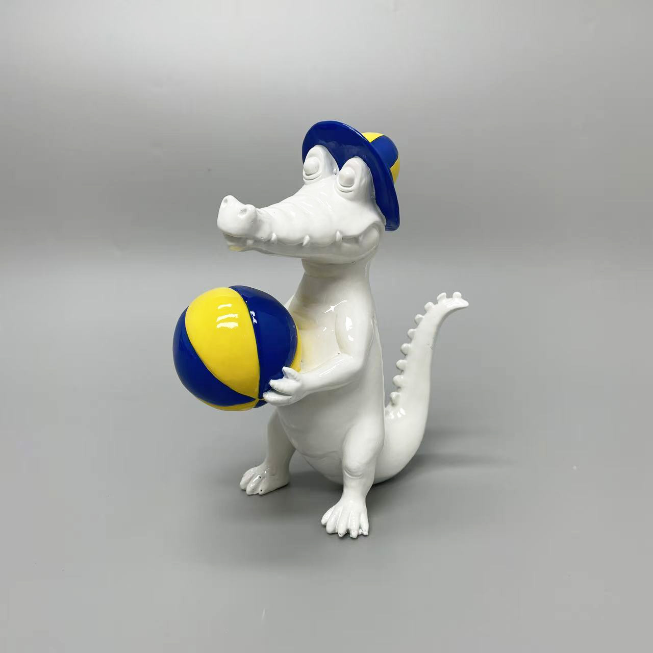 Crocodile carrying ball ornament