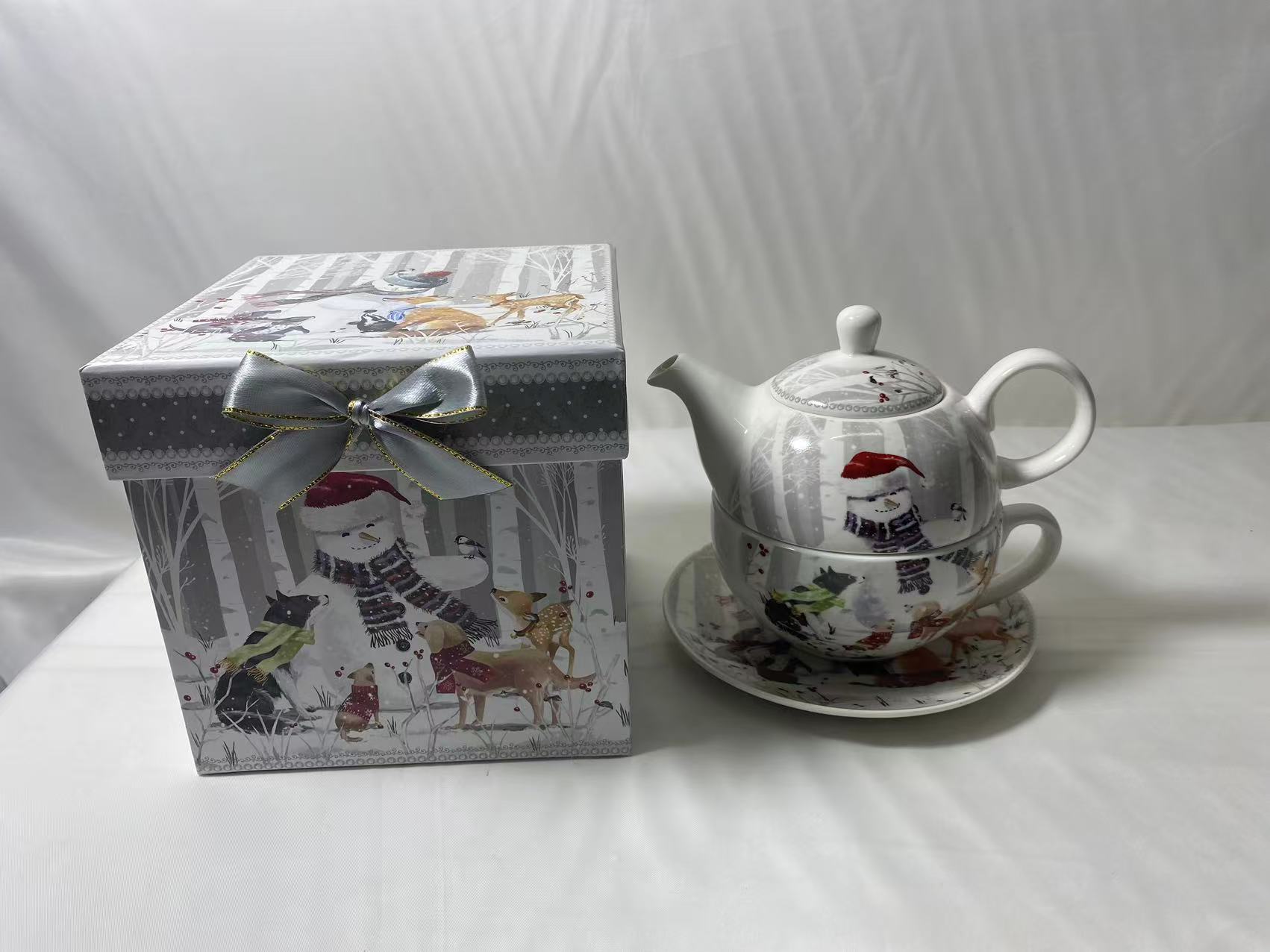Teapot with Cups and Saucers