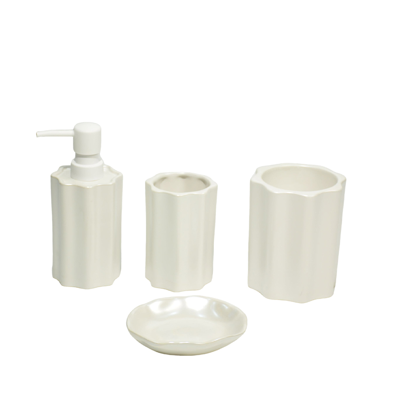 A four-piece bathroom set with milky white petal-shaped edges