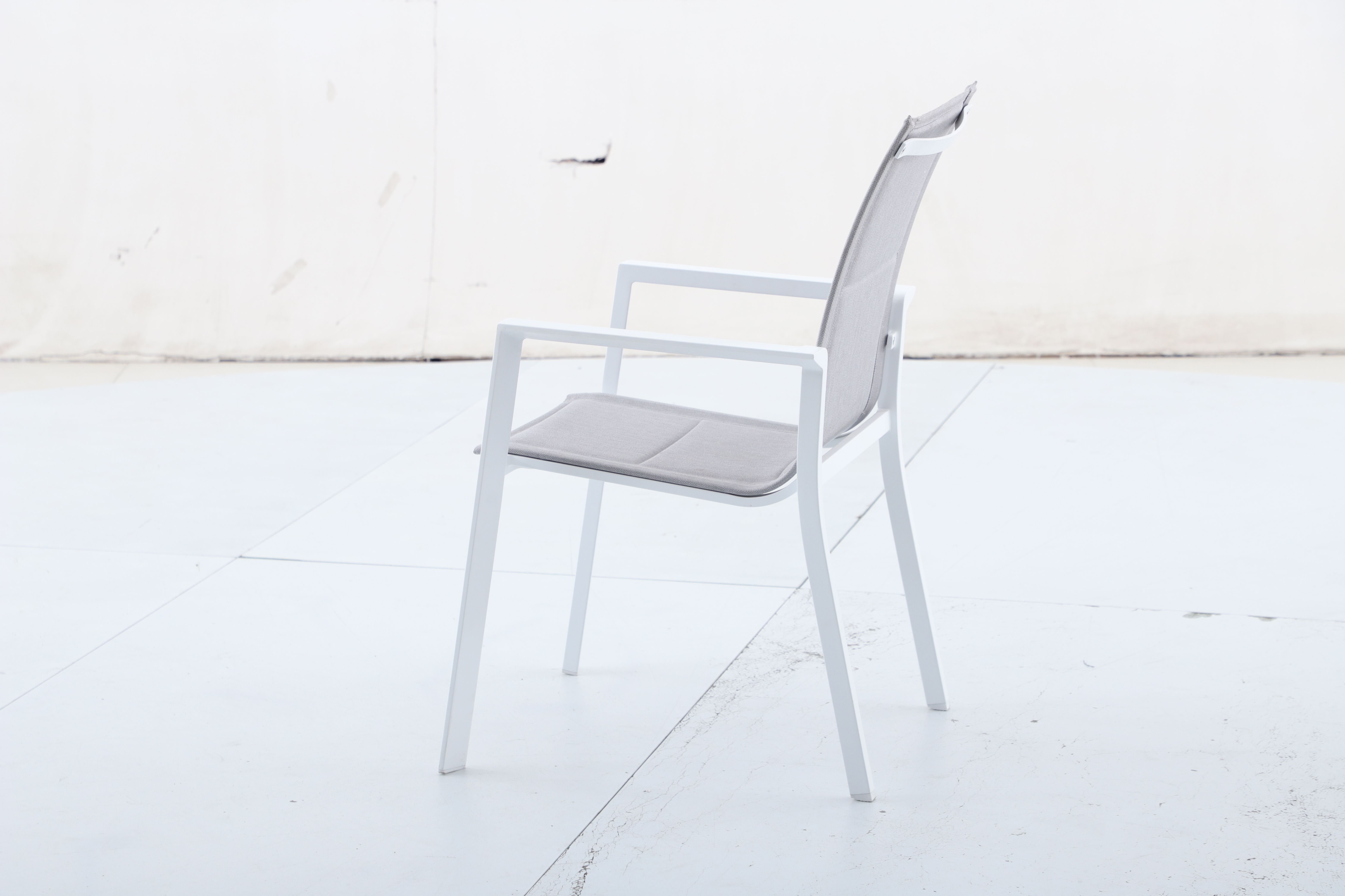 Alum sling padded armchair