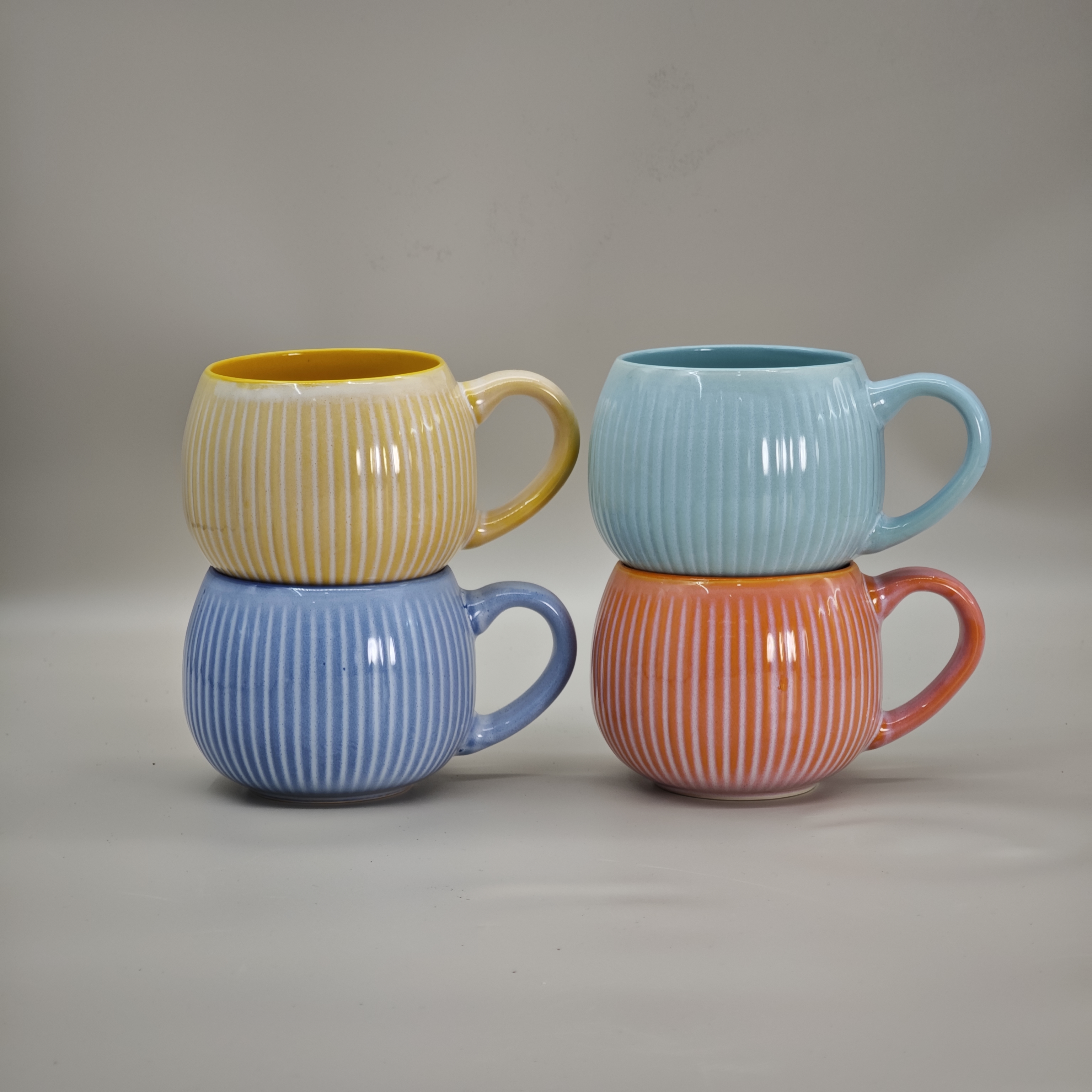Vertical stripe colored glazed spherical cup