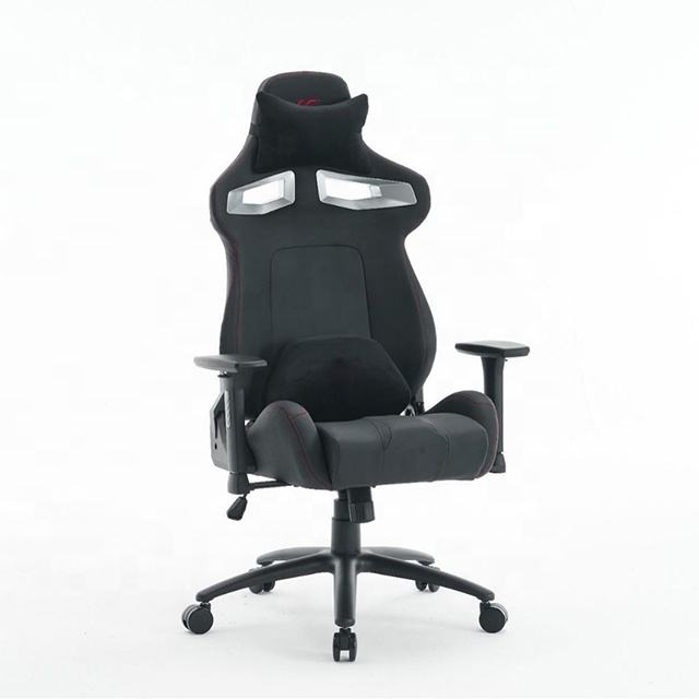Reclining high back video game chair with footrest