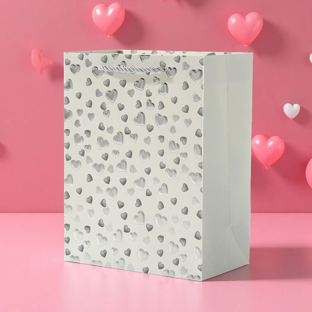 Beige heart embossed gift bag