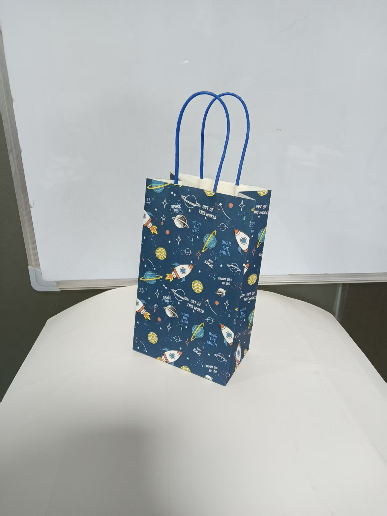 Deep sea blue space-themed gift bag