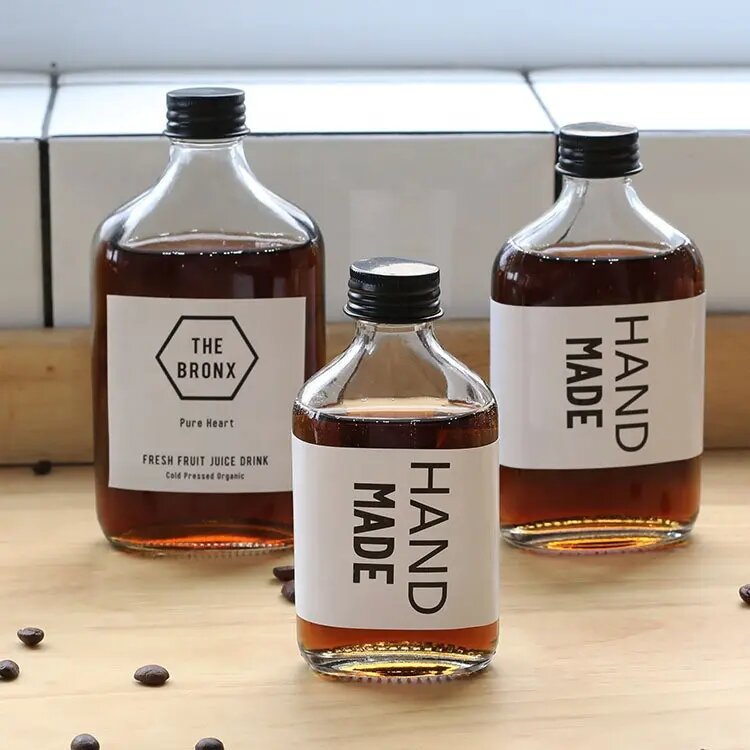 Wholesale slanted shoulder beverage bottles recyclable juice coffee bottles
