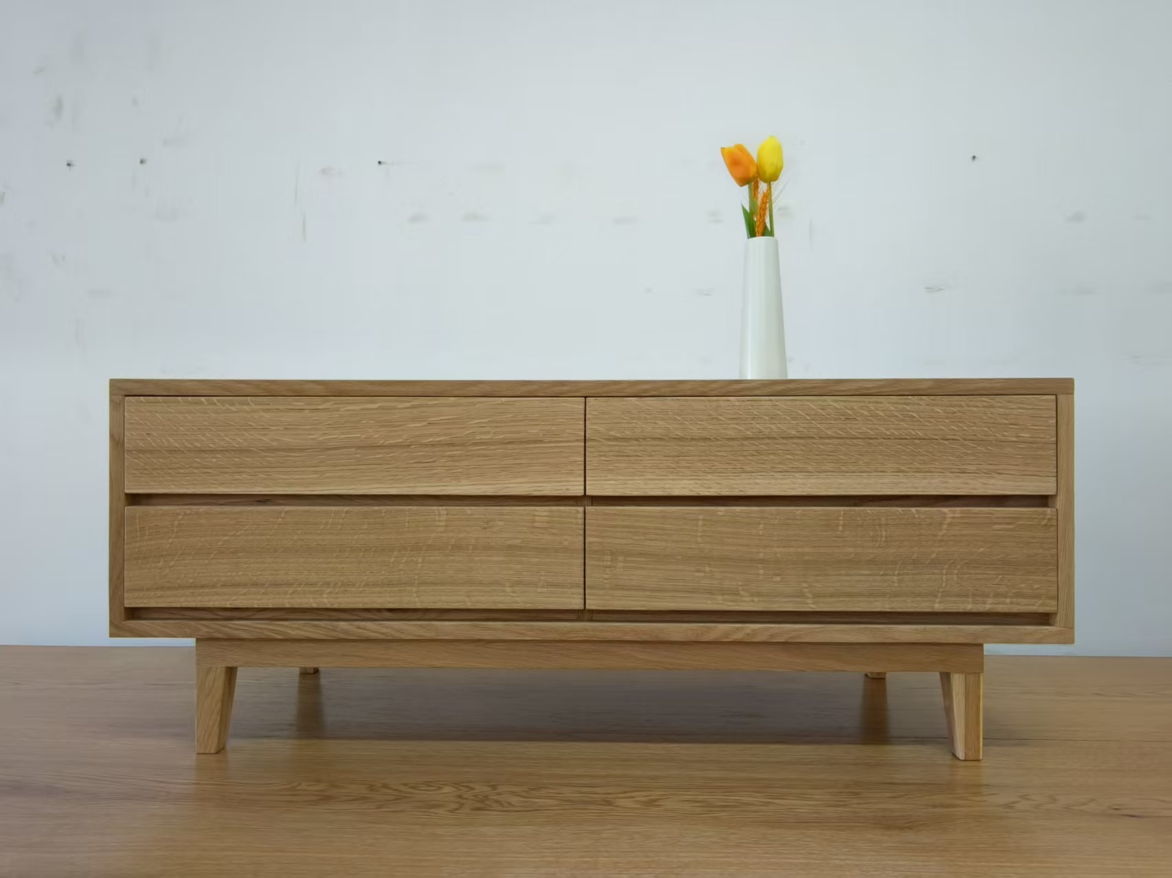 The coffee table is made of oak solid wood and oak solid wood